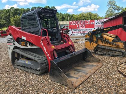 Takeuchi Skid Steer with Grapple Attachment  